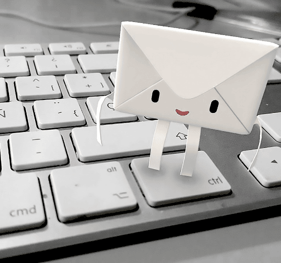 a white paper character on a keyboard